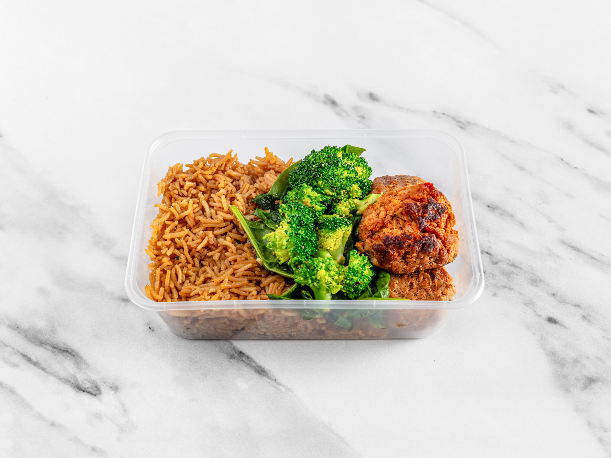 Chicken kofta with pilau rice, broccoli and spinach